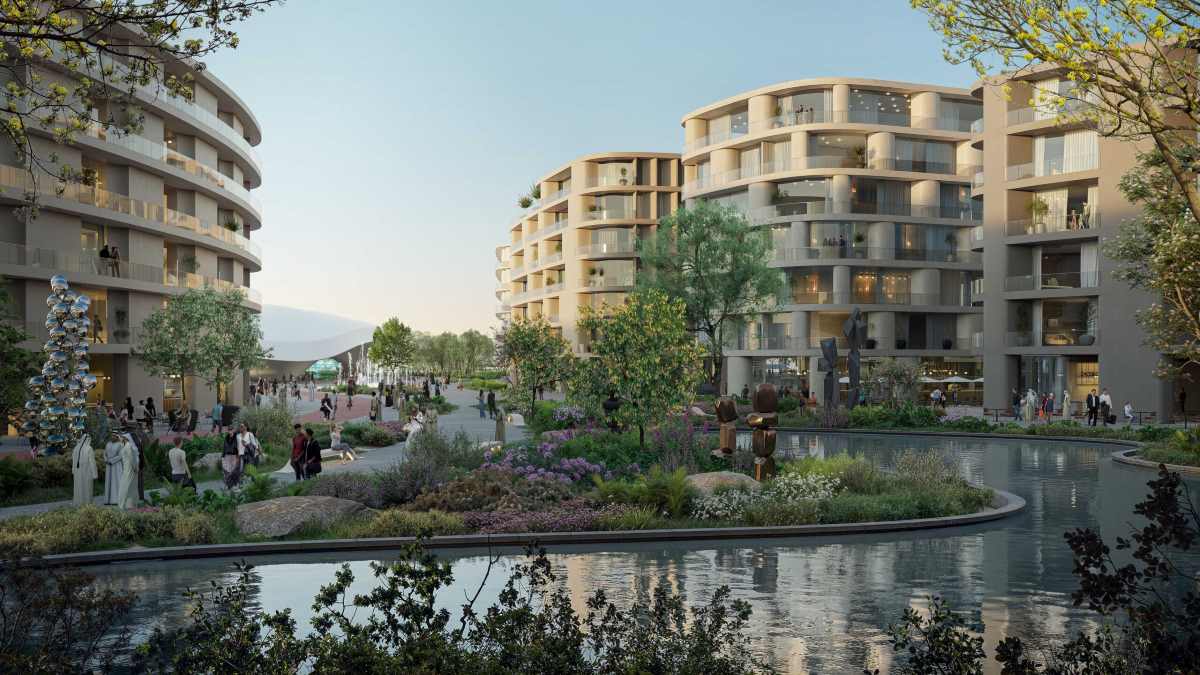 Contemporary residential buildings surrounding landscaped gardens and water canal in urban community