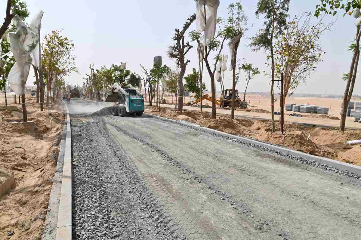 A Bobcat skid steer loader in a rental equipment for landscaping project prepares the site for forestation