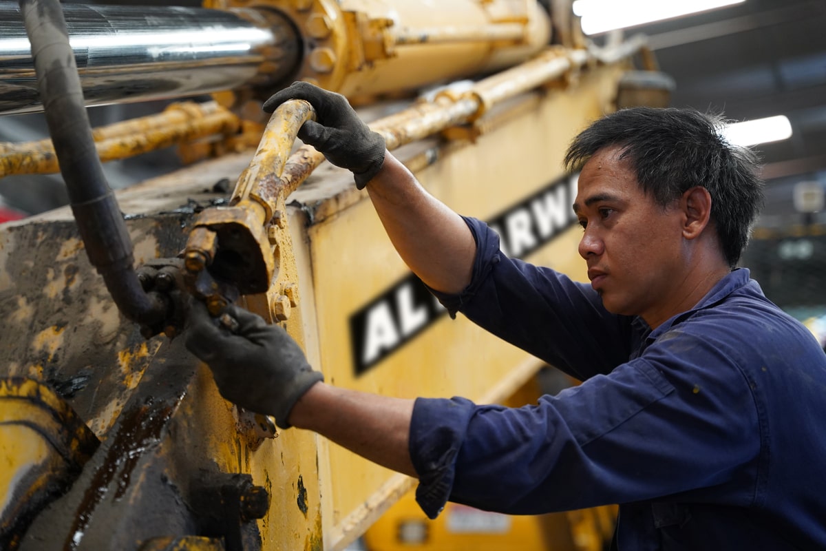 An Al Marwan technician is conducting repairs