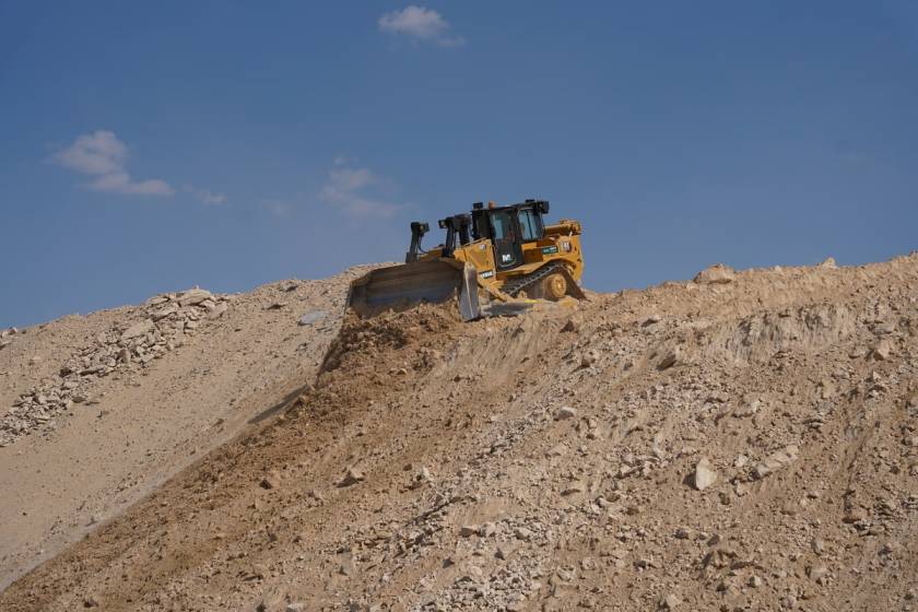 CAT D8T bulldozer at work on a desert construction site in Abu Dhabi, UAE as part of Al Marwan Heavy Machinery equipment rental fleet