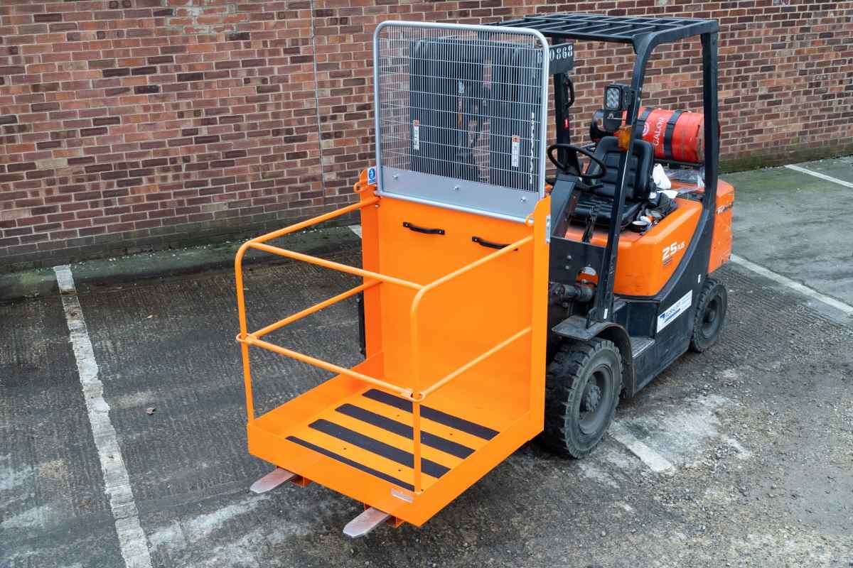 A small forklift attached t work platform