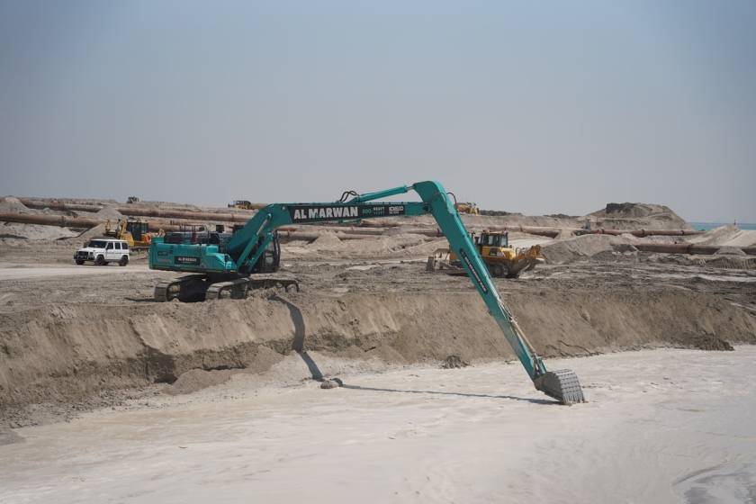 The 85-ton Kobelco SK850 long-boom excavator being operated on a sea dredging job as part of Al Marwan Heavy Machinery's equipment rental fleet in UAE