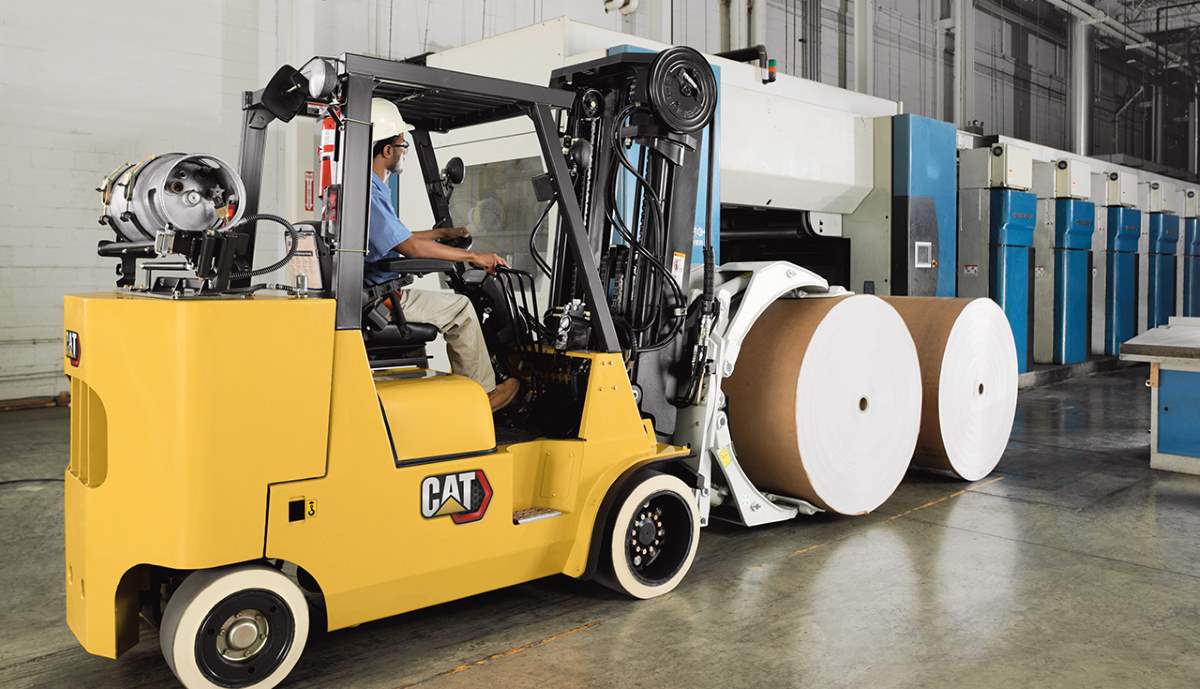 A CAT forklift attached to clamps